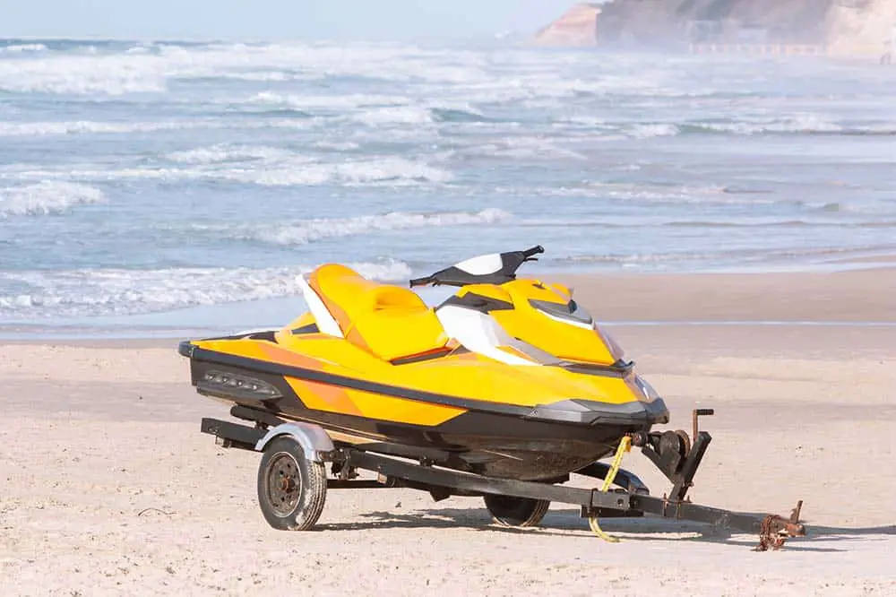 Jet ski on a trailer at the beach.