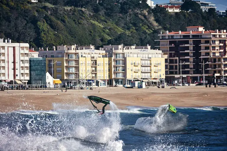 Jet skiers doing flip tricks