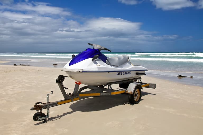 Jet ski on trailer in sand at the beach