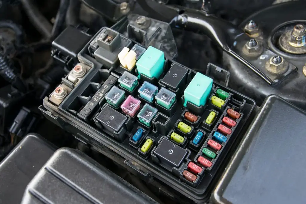 Close-up of fuse box in car. Differences between auto and boat fuses