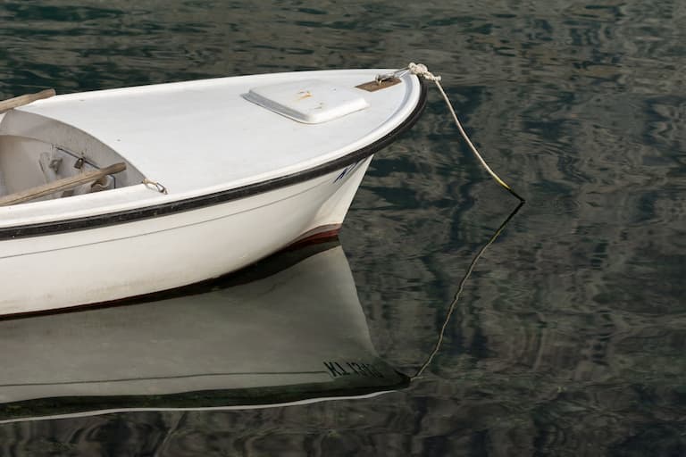 small boat moored in saltwater