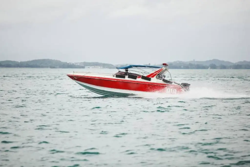 red boat moving on open water