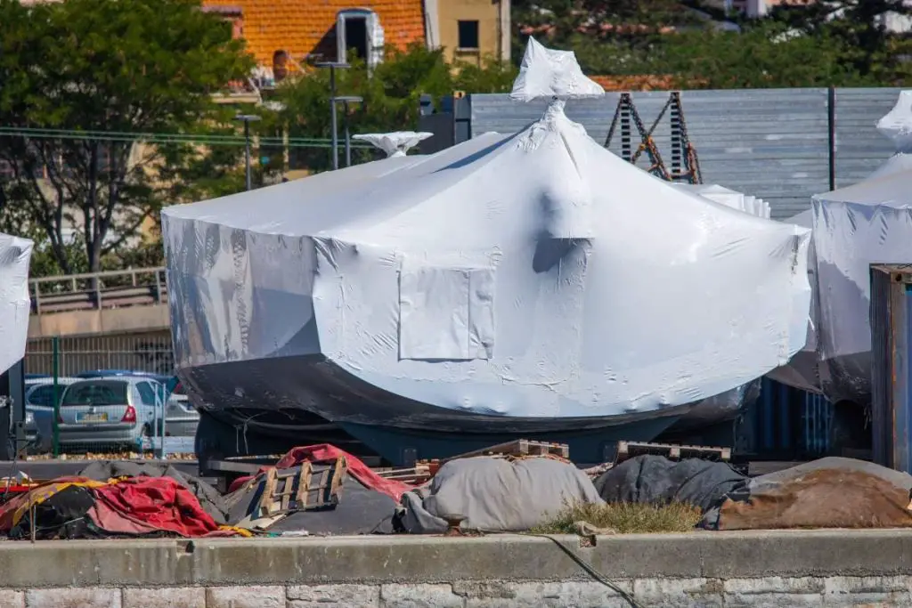 shrink wrapped boats stored ashore in pvc film