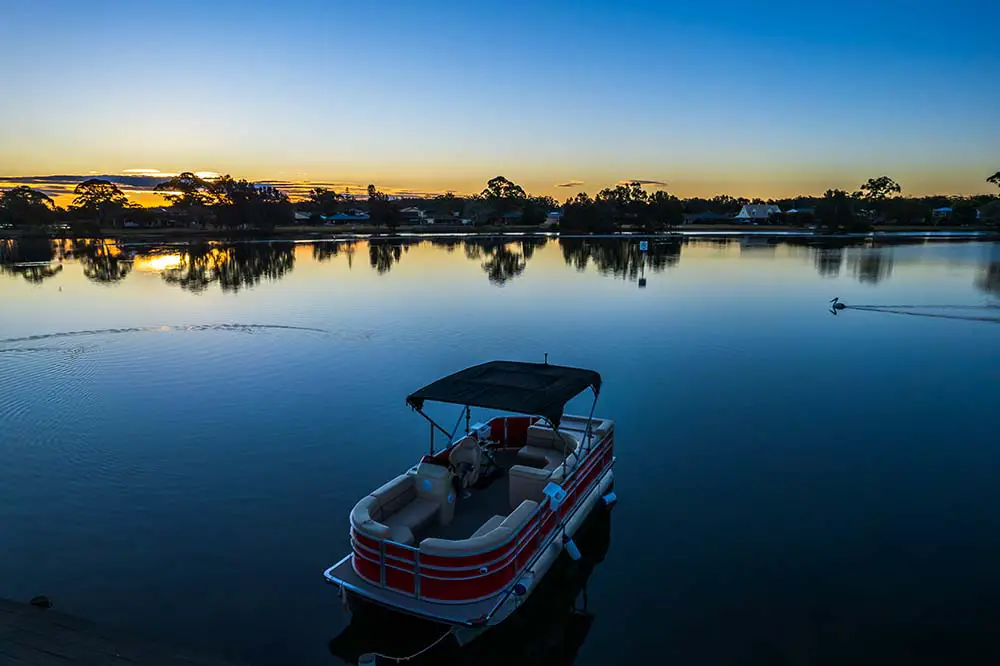 A pontoon boat on calm waters is hard to sink